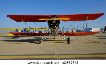 SHAFTER, CA - NOV 2: A vintage Myers Biplane sports a shiny aluminum fuselage and lots of wing area at the Minter Field Fly-In on Nov 2, 2013, at Shafter, California.