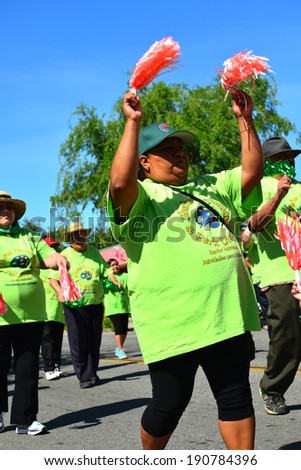 SHAFTER, CA - MAY 3, 2014: The members of the senior activities center march with enthusiasm in the Cinco de Mayo Celebration parade.