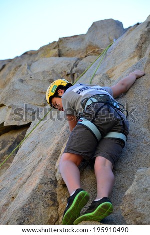 KERN COUNTY, CA-MAY 31, 2014: Teen students from Olive Knolls Christian School are getting climbing instruction today. First to go is Stevie Hall, making it look (almost) easy.