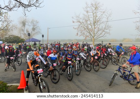 BAKERSFIELD, CA - JAN 17, 2015: Contestants line up at the start of the Rio Bravo Rumble cycling portion of the biathlon (running and mountain biking) under extremely foggy conditions.