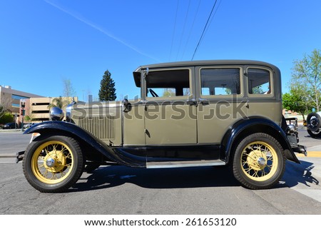 BAKERSFIELD, CA - MARCH 14, 2015: Members of the local Ford Model A club get together today to discuss their cars and socialize. This pristine 1930 four door sedan is present.