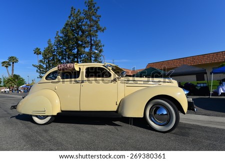 BAKERSFIELD, CA - APR 11, 2015: A 1939 Studebaker Commander is displayed today at the Calvary Baptist Church Spring Car Show. This sedan has fender skirts and even a side-mounted water cooler.