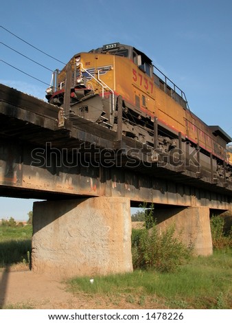 Freight train crossing railroad bridge