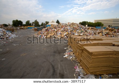 Bales, bundles and piles of paper and rags at a recycling center