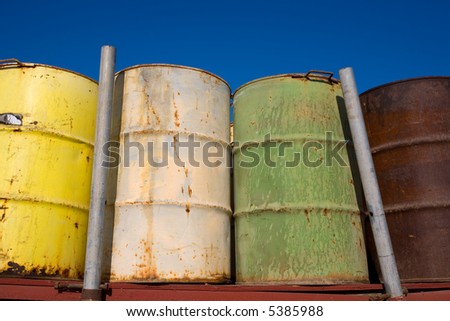 These fifty five gallon drums are stored empty and rusting