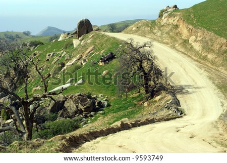 A dirt road meanders through the back country, Sierra Nevada Range, California