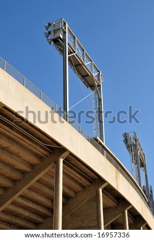 Banks of floodlights supported on steel frames, college football stadium