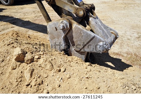 The business end of power equipment used for excavating and trenching on construction job sites
