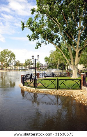 An urban renewal project in Bakersfield, California, took advantage of an irrigation canal to produce a park with rock-lined lake and covered bridge