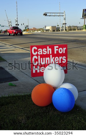 The government's CASH FOR CLUNKERS program is advertised by auto dealers