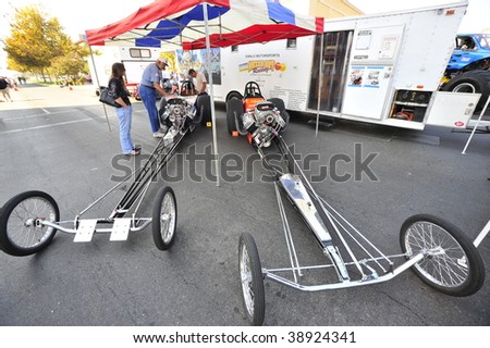 BAKERSFIELD, CA - OCT 10: Two rail dragsters, part of 400+ custom vehicles on display in the downtown area for the Highway 99 Cruise \