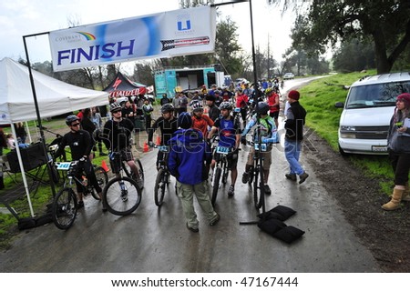 BAKERSFIELD, CA -FEB 21:Rain and cold at the start of the Foothill Classic Mountain Bike Race  do not deter contestants from racing February 21, 2010 in Bakersfield, CA