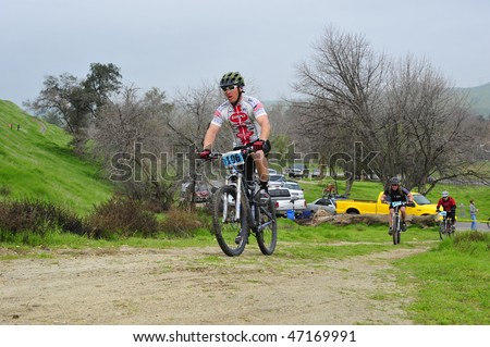 BAKERSFIELD, CA -FEB 21:Rain and mud during the Foothill Classic Mountain Bike Race do not deter contestants from racing February 21, 2010 in Bakersfield, CA