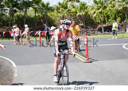 KONA, HAWAII - MAY 31: Unidentified amateur athletes compete in the Ironman 70.3 Half Triathalon shown on May 31, 2014 in Kona, Hawaii.  Brent McMahon and Angela Naeth of Canada won the event.
