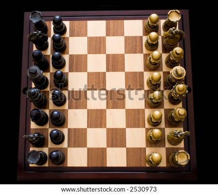 Fine, wooden chess board with a dark and a light stain.  Players are ready to go.