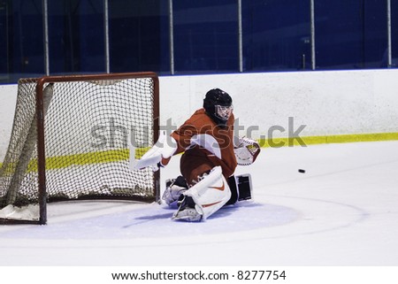 Hockey goalie in generic red equipment