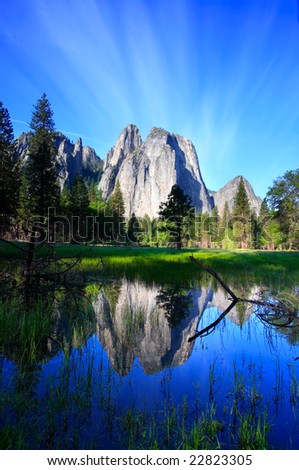 Yosemite\'s Cathedral Rocks reflecting in standing water.
