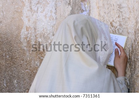 A Men is Praying At The Wailing Wall (western wall) , Jerusalem, Israel