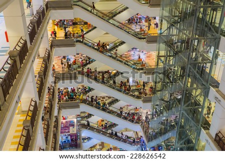 KUALA LUMPUR, MALAYSIA - CIRCA JUNE 2014: People in the Berjaya Time Square shopping complex. Berjaya Time Square is the most popular shopping destination in Malaysia.