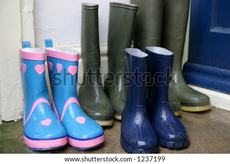wet wellington boots in doorway