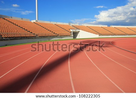 Run race track in sport stadium ,Spot light shadow