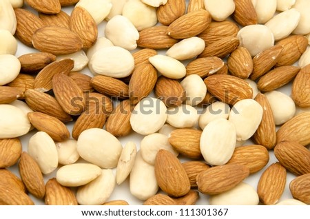 Several raw almonds white background surrounded by white background