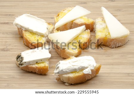Snack of bread with olive oil and goat cheese