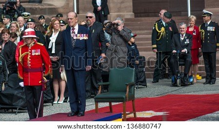 TORONTO-APRIL 27: Prince Philip, Duke of Edinburgh presents new Colours to The Royal Canadian Regiment. Canada celebrates the 200 anniversary of The Battle of York; as seen in Toronto April 27, 2013