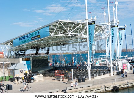 TORONTO,CANADA-MAY 11, 2014: The WestJet Stage is a 1,300-seat outdoor concert venue covered by a transparent roof and with open sides. The stage is fan-shaped and faces picturesque Toronto harbour.