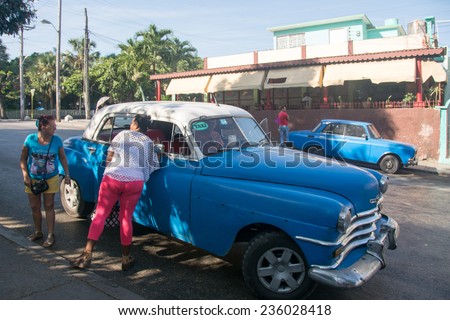 HAVANA,CUBA-JULY 5,2014: Old means of transportation in Havana city. The impoverished Revolution resorts to all kind of obsolete vehicles to transport the population including private old cars.