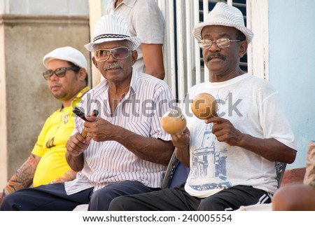 TRINIDAD,CUBA-JULY 22,2014: Cuban traditional music or son street performers in exchange for tourists tips. Trinidad in a UNESCO world heritage site and a major tourist landmark in Cuba