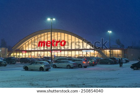TORONTO,CANADA-FEBRUARY 8,2015:Metro Grocery Store During a Snowstorm, Metro is a food retailer operating in the Canadian provinces of Quebec and Ontario.  Metro is the third largest grocer in Canada