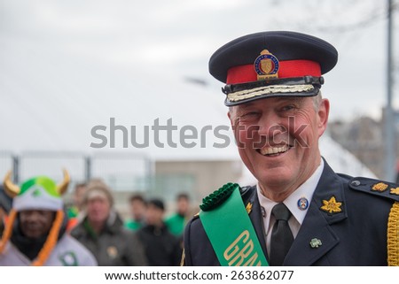 TORONTO,CANADA-MARCH 15,2015:Toronto Police Chief Bill Blair leads the 28th edition of the St. Patrick Day Parade as the Grand Marshal