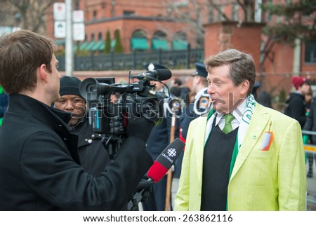TORONTO,CANADA-MARCH 15,2015:Toronto Mayor John Tory chat the media during the 28th edition of St. Patrick\'s Day Parade, the fourth largest in the world