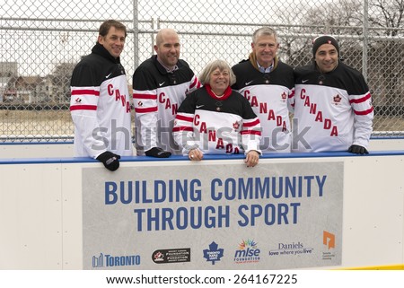 TORONTO,CANADA-JANUARY 3,2015:Pam McConnell Deputy Mayor of Toronto along with partners in the construction of the Regent Park ice rink. In the picture: Michael Bartlett,Chris Bright,and Remo Agostino