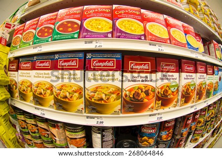 TORONTO,APRIL 4,2015: Campbells soup in store shelf. Campbell Soup Company, is an American producer of canned soups and related products. Campbell\'s products are sold in 120 countries around the world