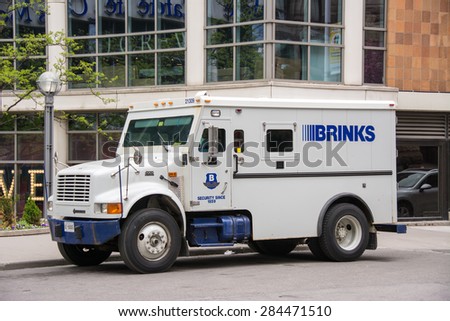 TORONTO,CANADA-MAY 17,2015: Brinks truck in Eaton Centre. The Brink\'s Company is an American security and protection company headquartered outside of Richmond, Virginia, United States.