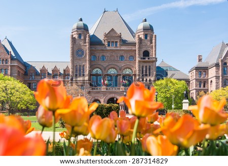Queen\'s Park building and tulip gardens, the landmark is the seat of the Ontario Provincial Government.