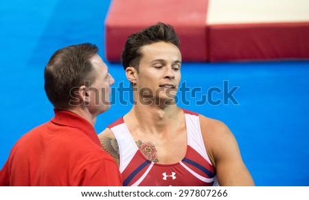 TORONTO,CANADA-JULY 15,2015: Paul Ruggeri from the United States gets third place and the Bronze Medal in the Men Horizontal Bar during the Gymnastic Artistic  Toronto Panam Games 2015-CN: 01953074