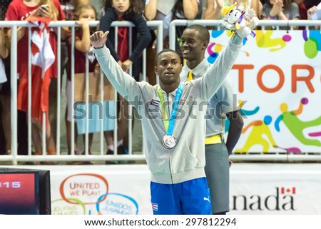 TORONTO,CANADA-JULY 11,2015: Manrique Larduet Cuban gymnast receives his Silver Medal for the All Around competition during the Toronto Pan American Games 2015 CN 01953074