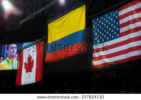 TORONTO,CANADA-JULY 15,2015: Toronto Pan American Games 2015: Medal award ceremony for men Horizontal Bar where Jossimar Calvo Moreno Gold, Kevin Lytwyn Silver and Paul Ruggeri Bronze.