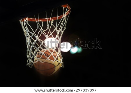 TORONTO,CANADA-JULY 16,2015: Toronto Pan American Games 2015: Official Molten basketball scoring two points in a high dynamic range scene with back light.