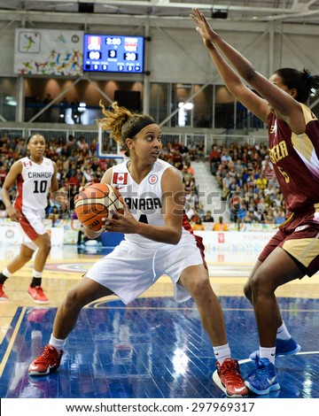 TORONTO,CANADA-JULY 16,2015: Toronto 2015 Pan Am or Pan American Games, women basketball: Marie Miah Langlois (4) from team Canada enters aggressively to the attack zone CN 01953074