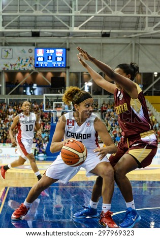 TORONTO,CANADA-JULY 16,2015: Toronto 2015 Pan Am or Pan American Games, women basketball: Marie Miah Langlois (4) from team Canada enters aggressively to the attack zone.CN 01953074