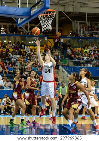 TORONTO,CANADA-JULY 16,2015: Toronto 2015 Pan Am or Pan American Games, women basketball: Katherine Plouffe (14) from team Canada shots the opponent bucket and scores a two pointer.CN 01953074