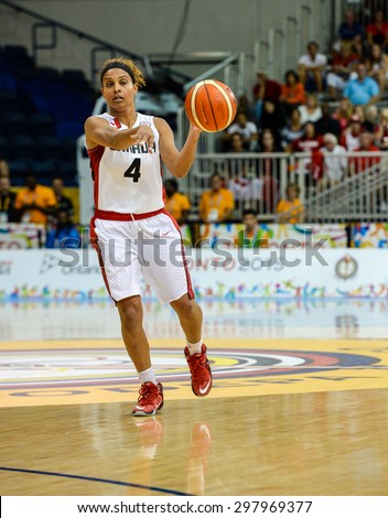 TORONTO,CANADA-JULY 16,2015: Toronto 2015 Pan Am or Pan American Games, women basketball: Marie Miah Langlois (4) controls the ball for team Canada and organized the attack .CN 01953074