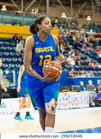TORONTO,CANADA-JULY 16, 2015: Toronto 2015 Pan Am or Pan American Games, women basketball: Karina Jacob forward of team Brazil carries the ball in the game against the US team.CN 01953074