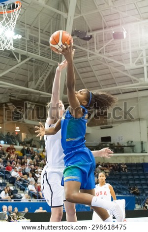 TORONTO,CANADA-JULY 16, 2015: Toronto 2015 Pan Am or Pan American Games, women basketball: Ramona from Brazil (blue) attack the United States hoop while Breanna Stewart defends.CN 01953074