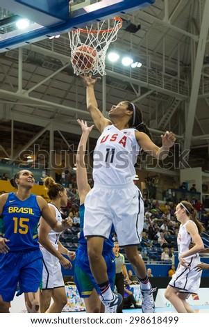 TORONTO,CANADA-JULY 16, 2015: Toronto 2015 Pan Am or Pan American Games, women basketball: Courtney Williams (11) from US looks for a defensive rebound under the United States hoop.CN 01953074