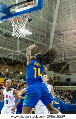 TORONTO,CANADA-JULY 16, 2015: Toronto 2015 Pan American games,women basketball: Ramona (14) from Brazil aggressively attacks the United States hoop with large jump.CN 01953074